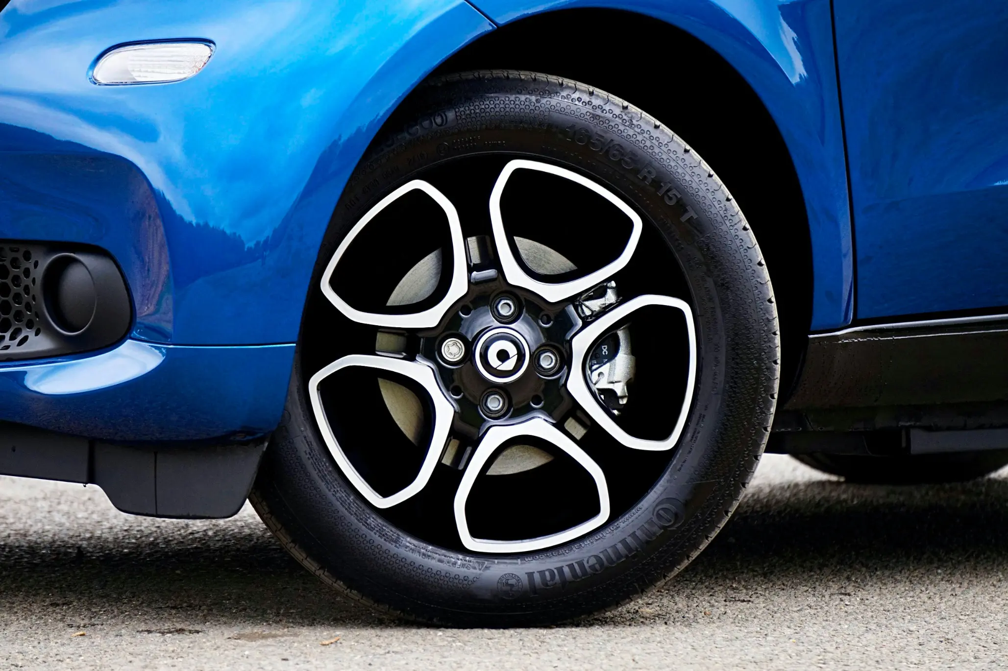 Close-up of Smart Car front wheel during Smart Car maintenance and repair service in Fort Worth, TX with Mercedes-based diagnostics expertise