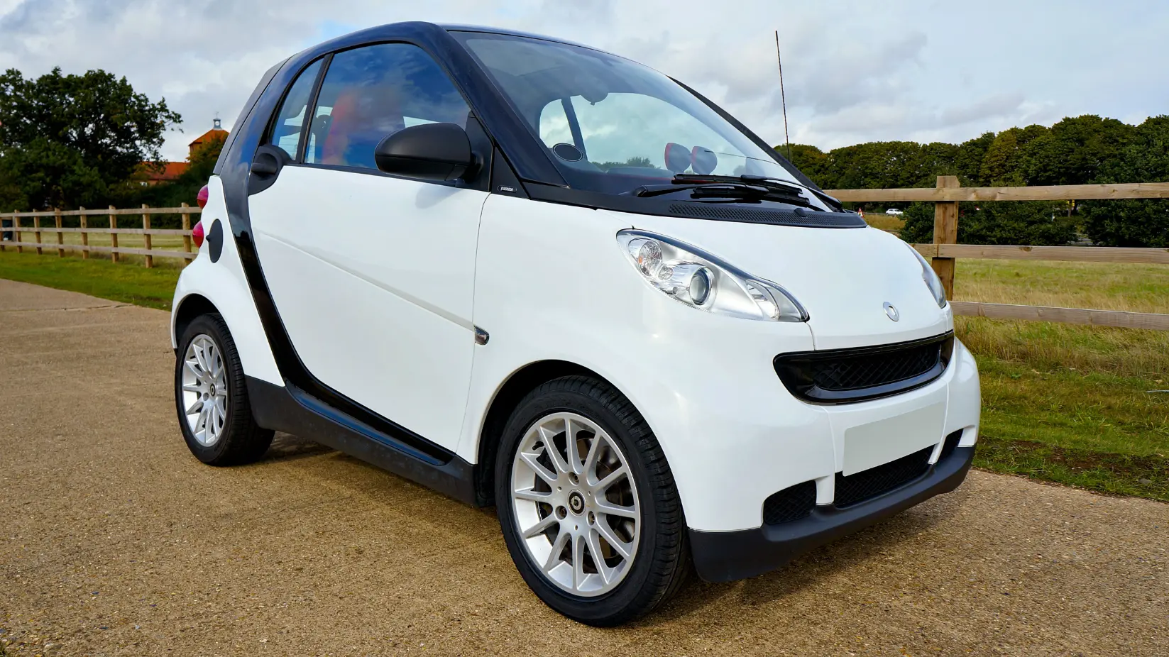 White small two-door Smart Car during Smart Car maintenance and repair service in Fort Worth, TX diagnosing 3-bar transmission error issues